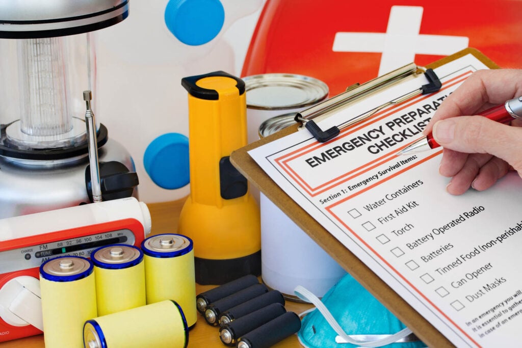 Emergency preparation checklist with survival supplies and first aid kit