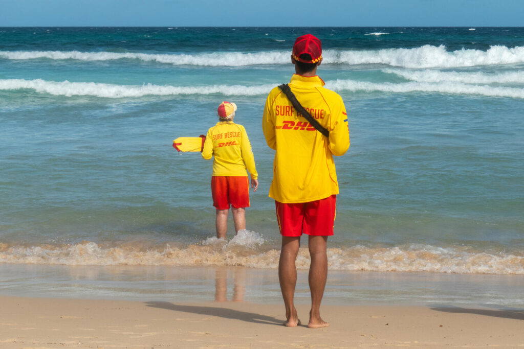 Two surf rescue volunteers watching the ocean on patrol