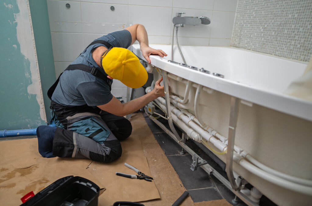 plumber-installing-a-bathtub